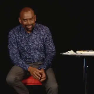 Jesse laughs while talking with the Church congregation